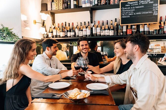 Madrid Local Tapas, Wine Bars & Flamenco Show - Iberian ham on Calle del Arenal