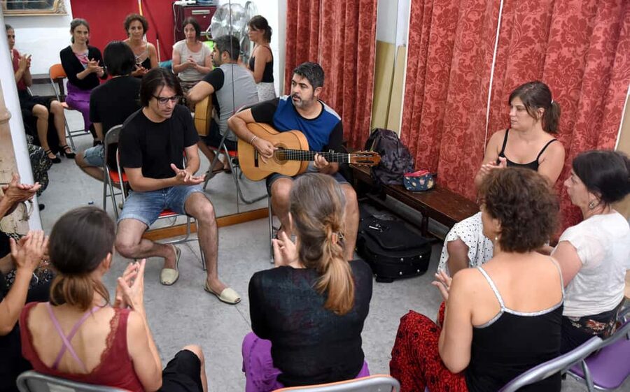 Seville: Flamenco Hand Clapping Workshop with Dancer - Entering a central Seville flamenco studio