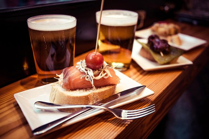 Tapas and Flamenco Show Small Group Tour in Barcelona - El Born ham, cheese, and old streets